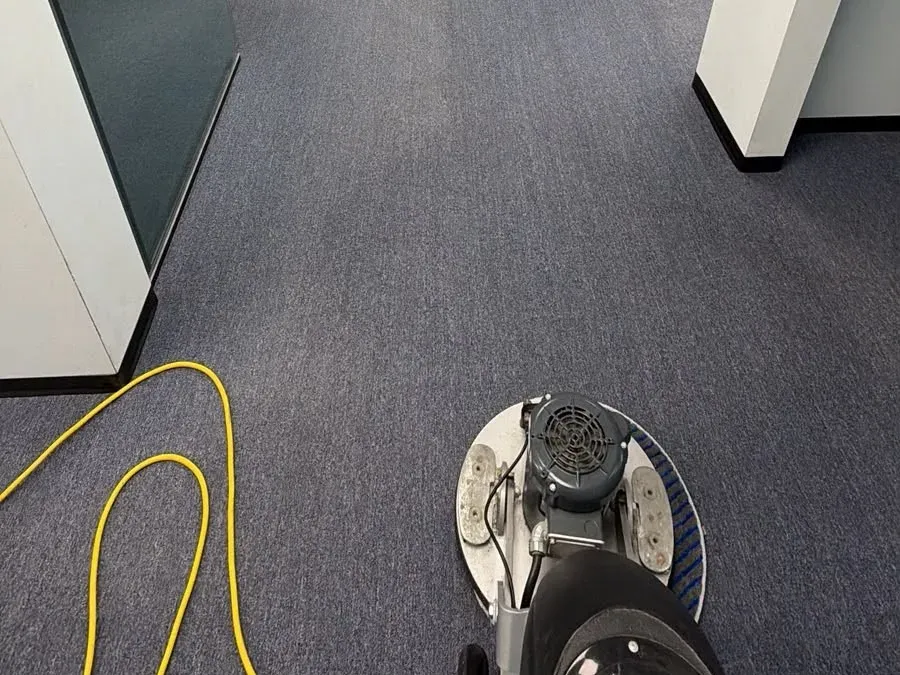Rotovac rotary machine cleaning a common area traffic lane in a Chilliwack strata building